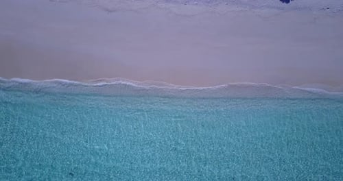 Wide drone travel shot of a white sand paradise beach and aqua turquoise water background in best qu