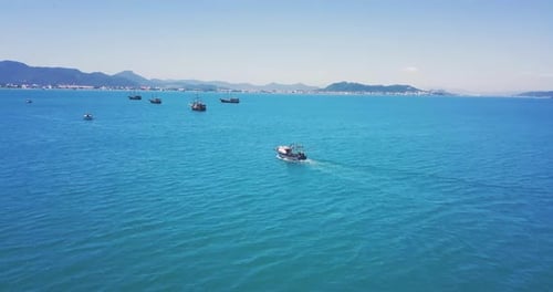 4k Cinematic Shot of Aerial Drone Following Fishing Boat in Paradise Beach