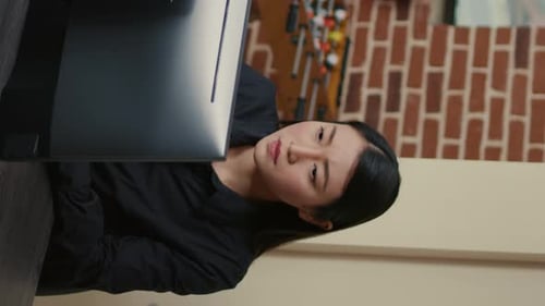 Vertical Video Portrait of Asian Programer Focused on Writing Code Encounters Unexpected Compiling