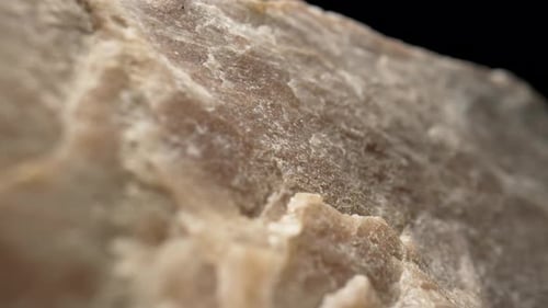 Solid Piece of Granite or Quartz Stone Against Black Background