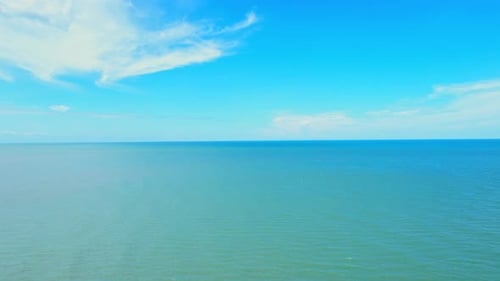 An aerial view over the sea, beautiful sky and clouds