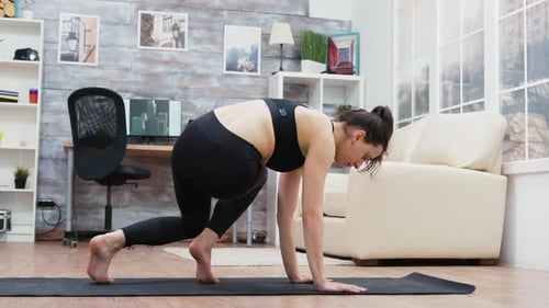 Side View of Young Female Doing Yoga Training