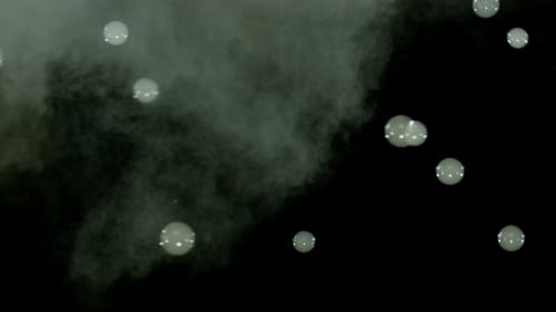 Rising Soap Bubbles with Smoke on Black Background