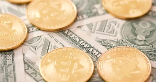 Golden Bitcoins on US Dollar Bill Currency