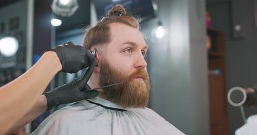 Man Getting Beard Trimmed at Barber Shop