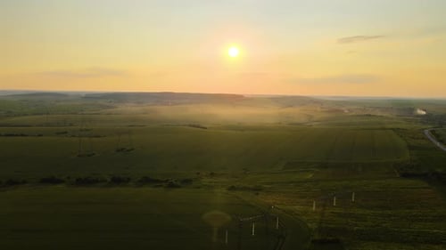 Aerial View of Golden Hour Over Rolling Farmlands