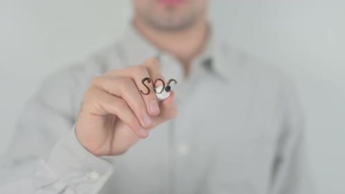 Man Writes Social Security on Transparent Surface