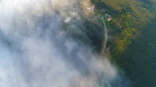 Scenic Aerial View of Clouds Over Hillside