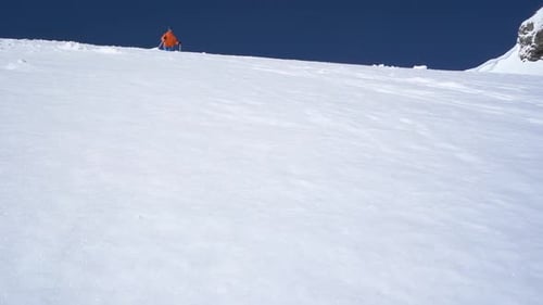 Low Angle View Slow Motion of Skier Splashing Snow