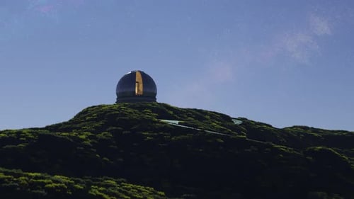A modern astronomical observatory in a vast meadow valley during a night. 4KHD