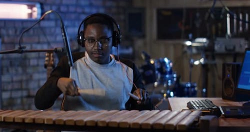Young Musician Playing in Home Studio