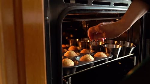 Checking Baked Muffins in the Oven