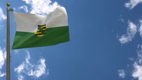 Realistic Waving Flag of Saxony, Germany in Blue Sky