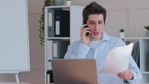 Concentrated Emotional Business Man Caucasian Male Worker Manager Sitting at Office Table with