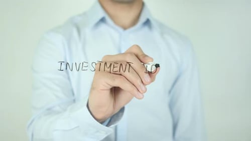 Writing Investment Ideas on Clear Surface