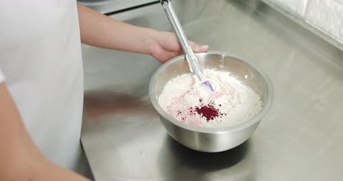 Close Up Cropped Shot of Female Confectioner Making Cream for Cake or Cookies