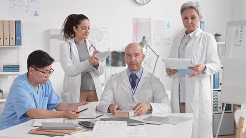 Doctors Posing on Camera in Office
