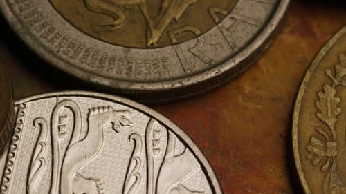 Rotating stock footage shot of international monetary coins