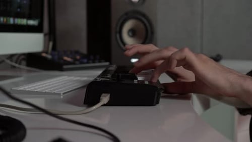 Hands Play Keyboard in Recording Studio