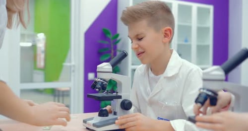 Children Learn Science with Microscopes in Classroom