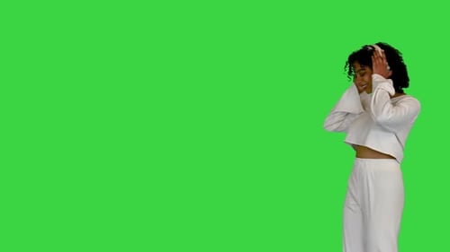 Mixed Race Woman Walking Listening Music Headphones Green Screen Chroma Key