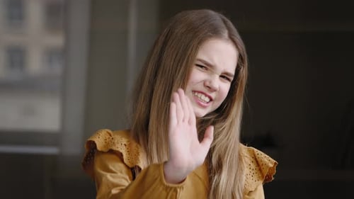Girl Says No With Hand Gesture