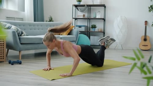 Blonde Woman Doing Push-Ups at Home