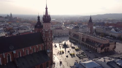 Krakow Historic Market Square, Aerial Pullback, Golden Hour Sunset.