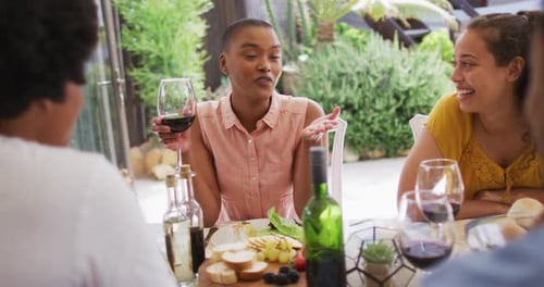 Friends Enjoying Wine and Cheese Outside