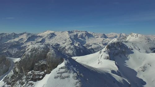 Aerial View of Snow-Covered Mountain Range in Winter