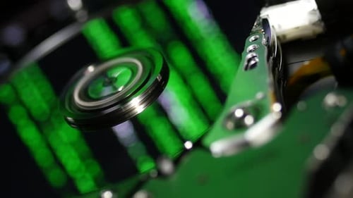 Spinning Computer Hard Drive with Green Light