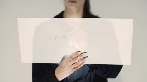 Corporate Woman Writing Leadership On A Board