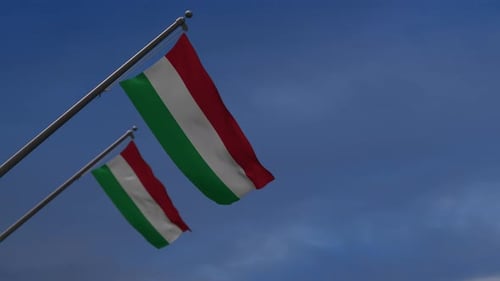 Hungarian National Flag Waving in Blue Sky