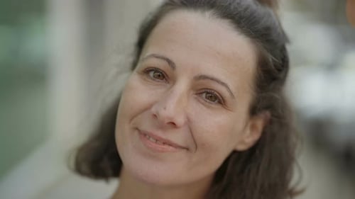 Close Up of Adult Woman Smiling at Camera