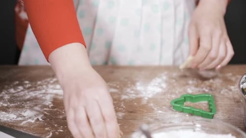 Woman Rolling Dough for Cookies at Home