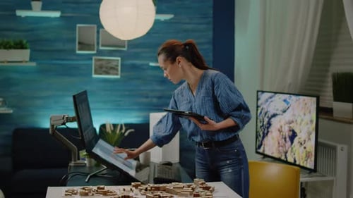 Architectural Manager Checking Building Model on Tablet