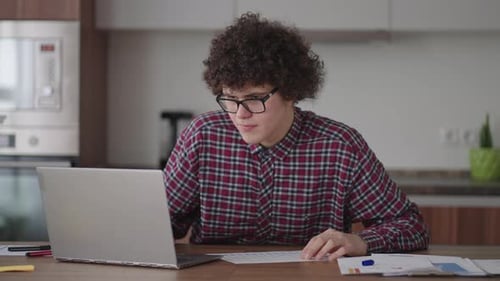 Student with Curly Hair Studying at Home