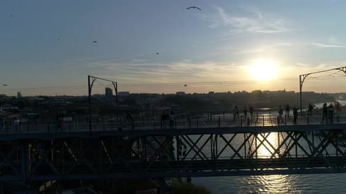 People on The Bridge at Sunset