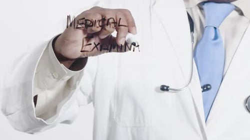 Doctor Writing "Medical Examination" on Clear Surface