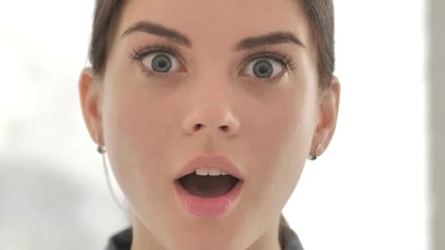 Close Up of Face of Young Girl Wondering in Shock