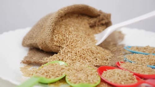 View of plastic spoon stuck in sesame seeds bag