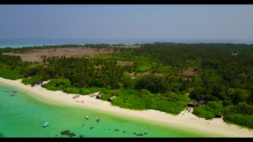Aerial above sky of tranquil seashore beach wildlife by blue lagoon with white sandy background of j