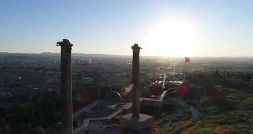 Aerial View of City with Flag and Columns