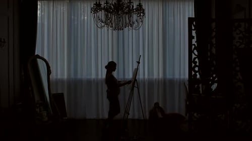 Silhouette of an Artist Who Draws on Canvas in a Drawing Studio.