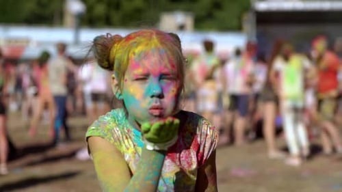 Child Covered in Color at Holi Festival