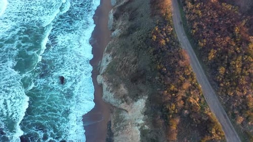 Aerial view to a beautiful wild rocky beach and big waves
