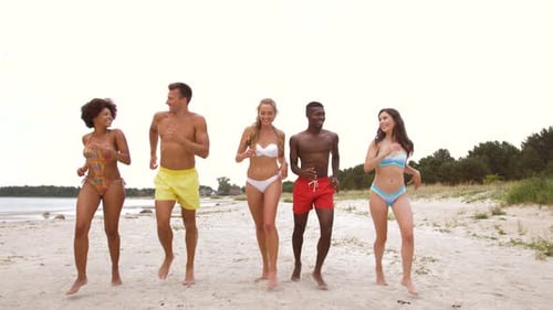 Happy Friends Running on Summer Beach