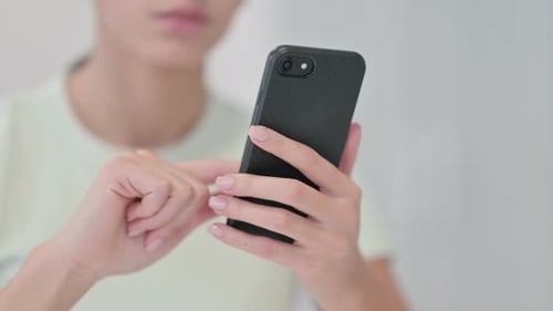 Close Up of Female Hand Using Smartphone