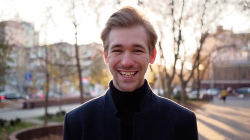 Handsome Young Adult Laughing in Urban Setting