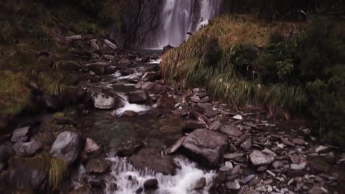 Aerial View of Waterfall in Lush Green Forest